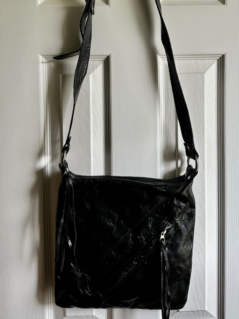Textured Black Shoulder Bag with Fringe Accents